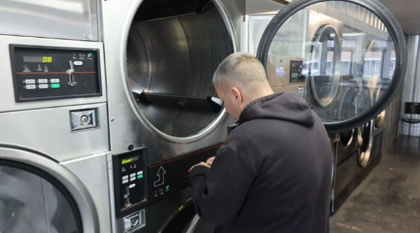 Technician repairing a dryer heating element in an Abilene, TX home