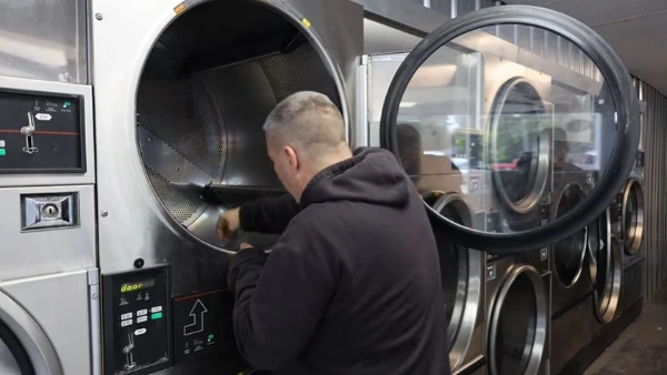 Technician repairing a dryer in an Abilene, TX home