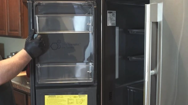 Technician repairing an ice maker in an Abilene, TX home