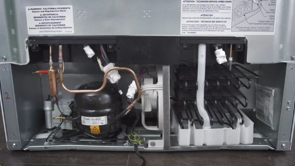 Technician repairing a refrigerator compressor in Abilene, TX